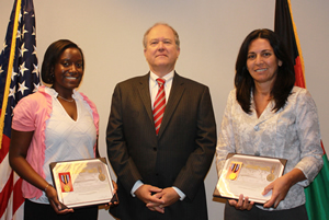 John F. Sopko presents awards to SIGAR staffers Gabriele and Angie