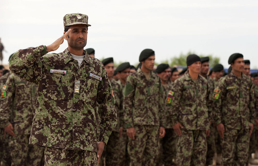 Afghan National Army (ANA) soldiers graduation ceremony from the basic warrior course. Soldiers are wearing forest pattern uniform.