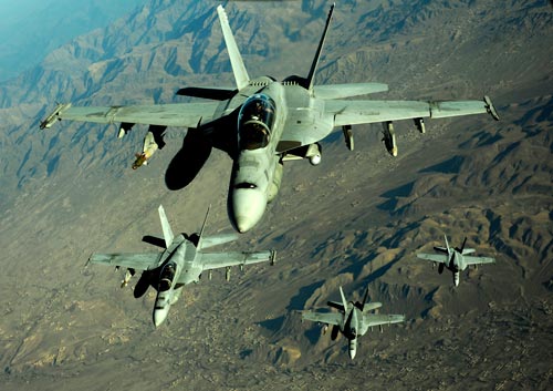 Four U.S. Navy F/A-18 Hornet aircraft fly over mountains in Afghanistan. (U.S. Air Force photo by Staff Sgt. Andy M. Kin)