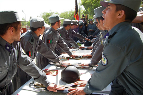 Noncommissioned officers of the Afghan National Police recite an oath of honor at a graduation ceremony May 19, 2008, at the ANP Academy in Kabul, Afghanistan. Nearly 1,700 NCOs graduated from a five-month course at the academy. (U.S. Air Force photo by Beth Del Vecchio)